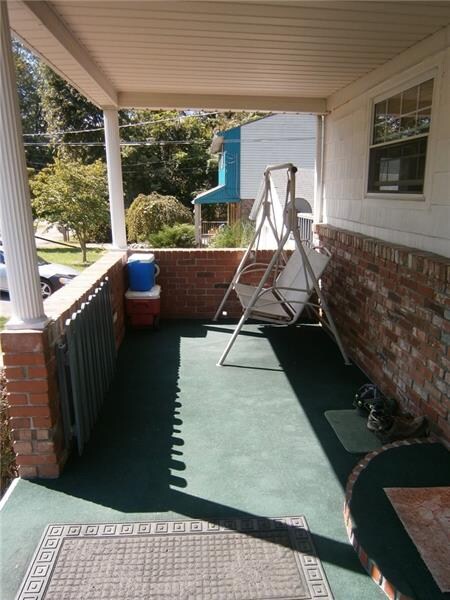 THE WELCOMING COVERED FRONT PORCH