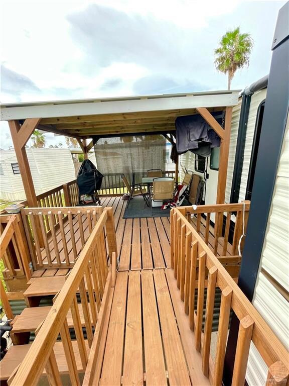 ADDITIONAL COVERED PATIO AREA WITH OUTDOOR TV, BAR-B-Q PIT AND OUTDOOR FURNITURE INCLUDED