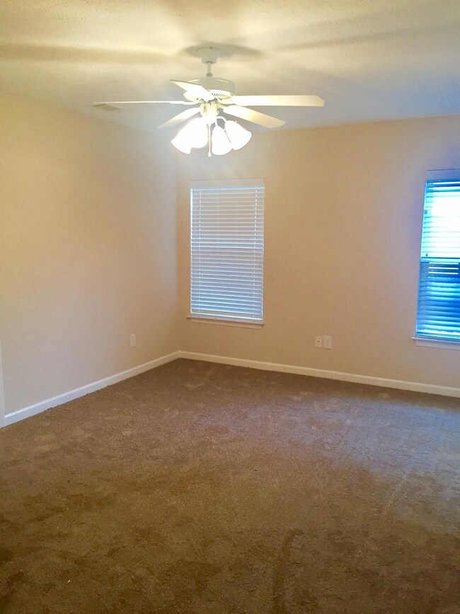 Master bedroom downstairs with plenty of natural light