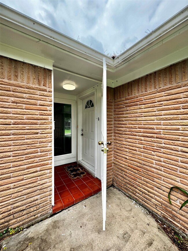 Covered front porch with additional metal gate security!