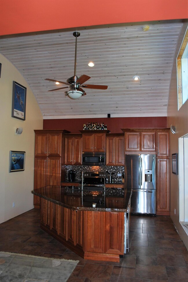 Barrel wood ceiling in living/kitchen