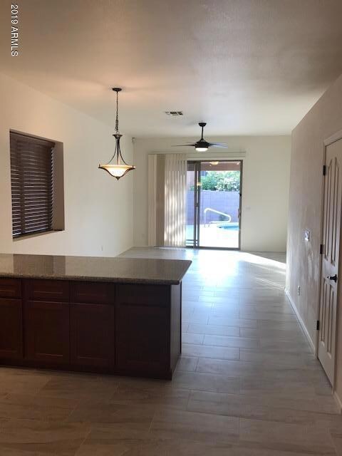 Kitchen looks out to Family Room