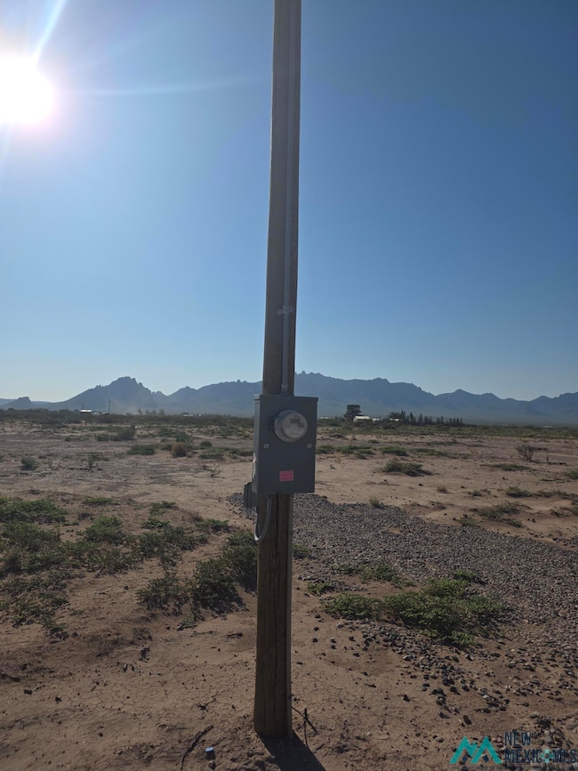 View of mountain backdrop featuring rural landscape