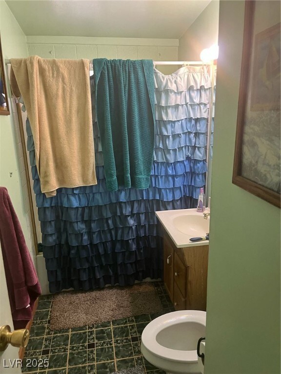 Full bathroom with vanity and curtained shower