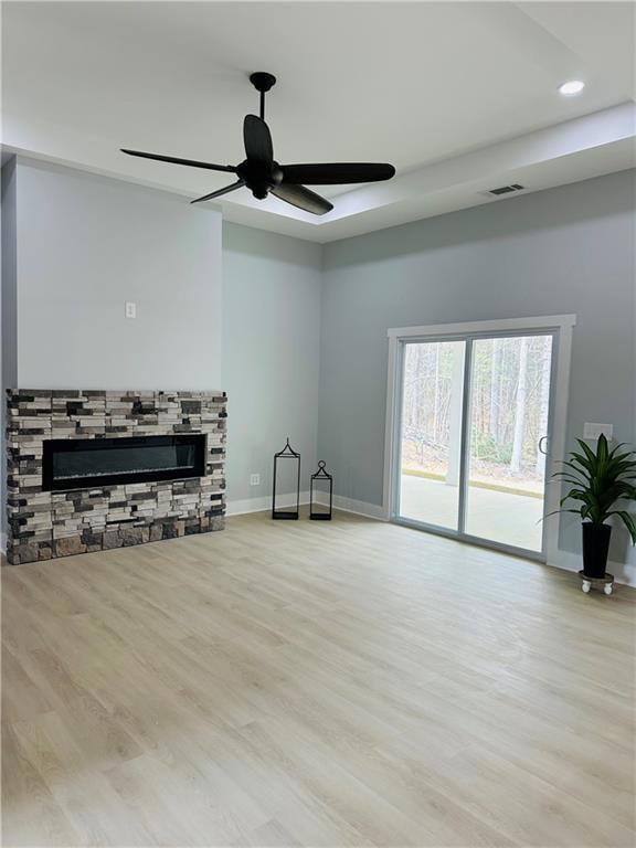Living room with baseboards, visible vents, a ceil