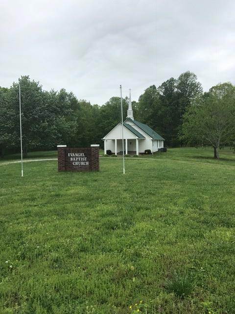 To the left of the property is a quaint country church