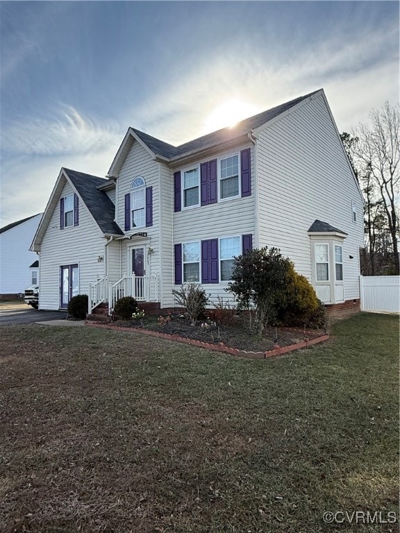 View of front of house with a front lawn