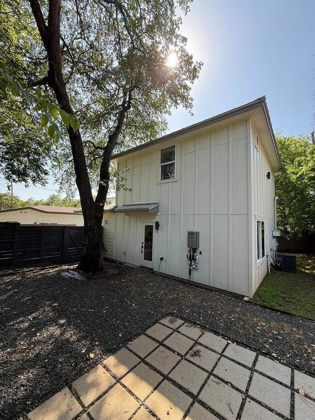 Rear view of property featuring board and batten 