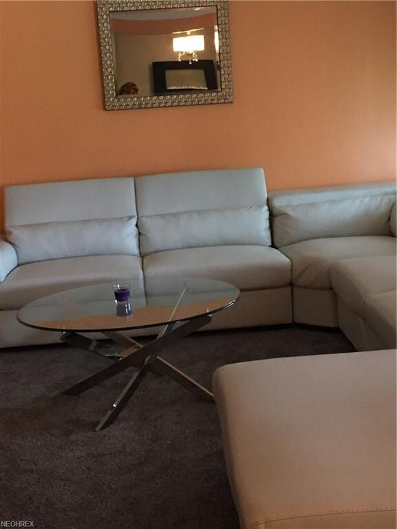 Large living room with new carpet and freshly pain