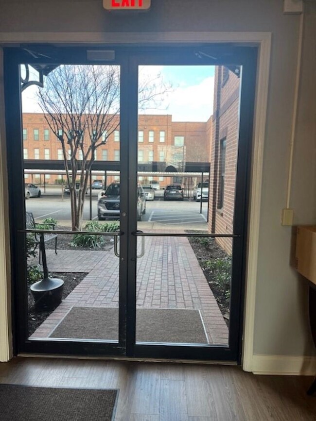 Doorway to outside featuring wood-type flooring an