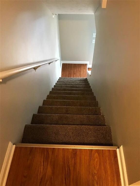 Stairway with wood finished floors