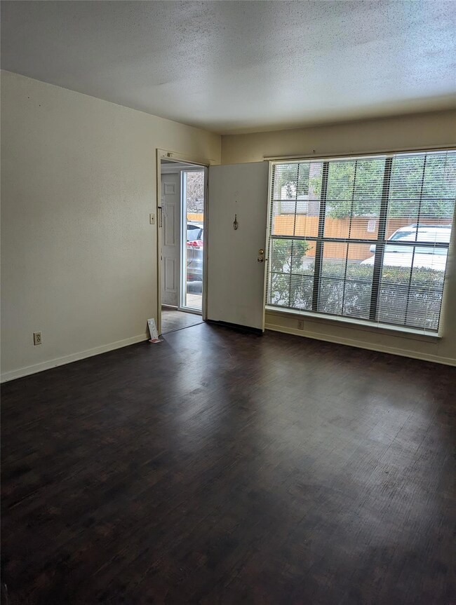Spare room featuring a healthy amount of sunlight,