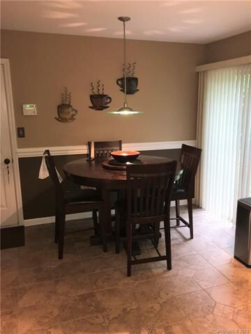 Updated Kitchen with New Kitchen Cabinetry, Countertops and Backsplash.  Stainless Appliances including Gas Range, Microwave Oven and Refrigerator.