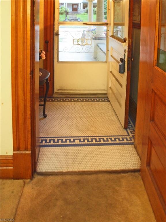 Hexagonal tiles with a Greek Key design cover the 