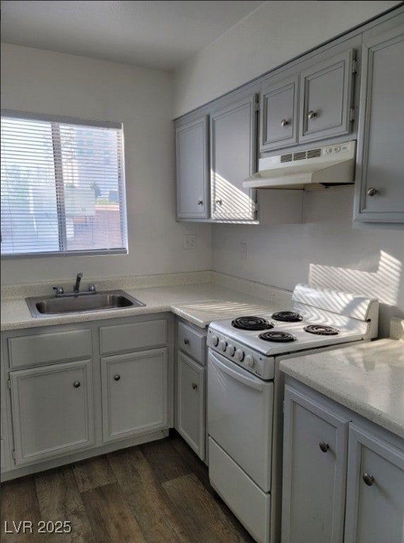 Kitchen featuring white electric stove, under cabi
