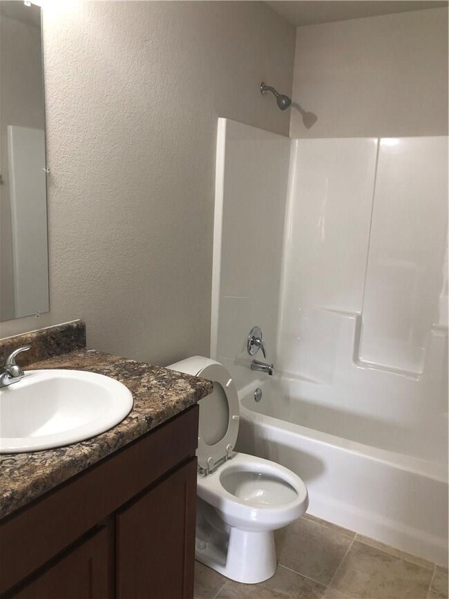 Full bathroom right next to bedrooms 2 & 3. The ma