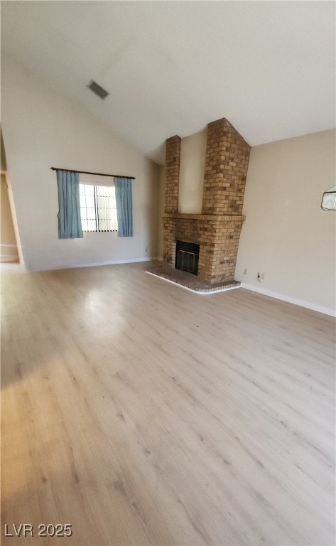 Unfurnished living room featuring vaulted ceiling,