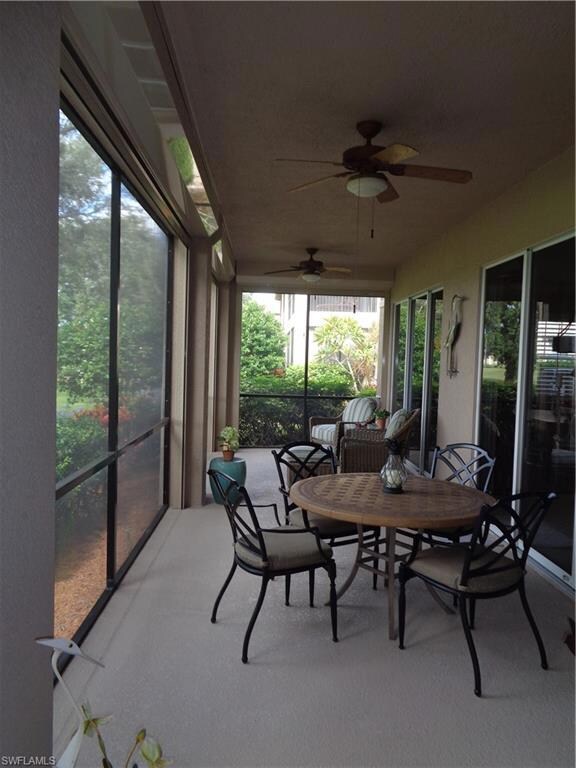 Sunroom / solarium featuring ceiling fan