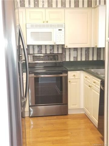 Kitchen is partially enclosed but does have a lot 