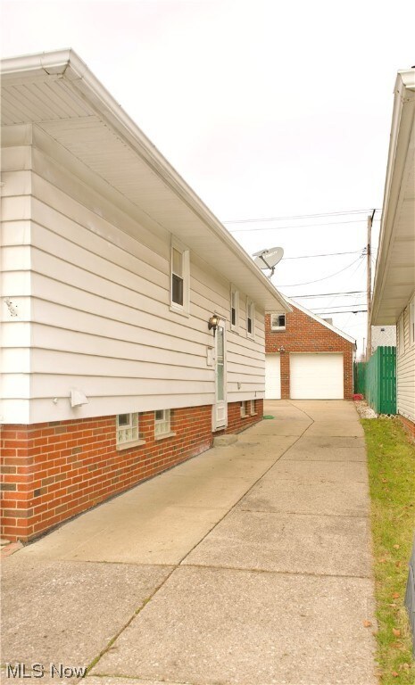 View of side of home featuring a garage