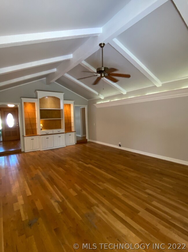 built in cabinet in living room, opposite fireplac