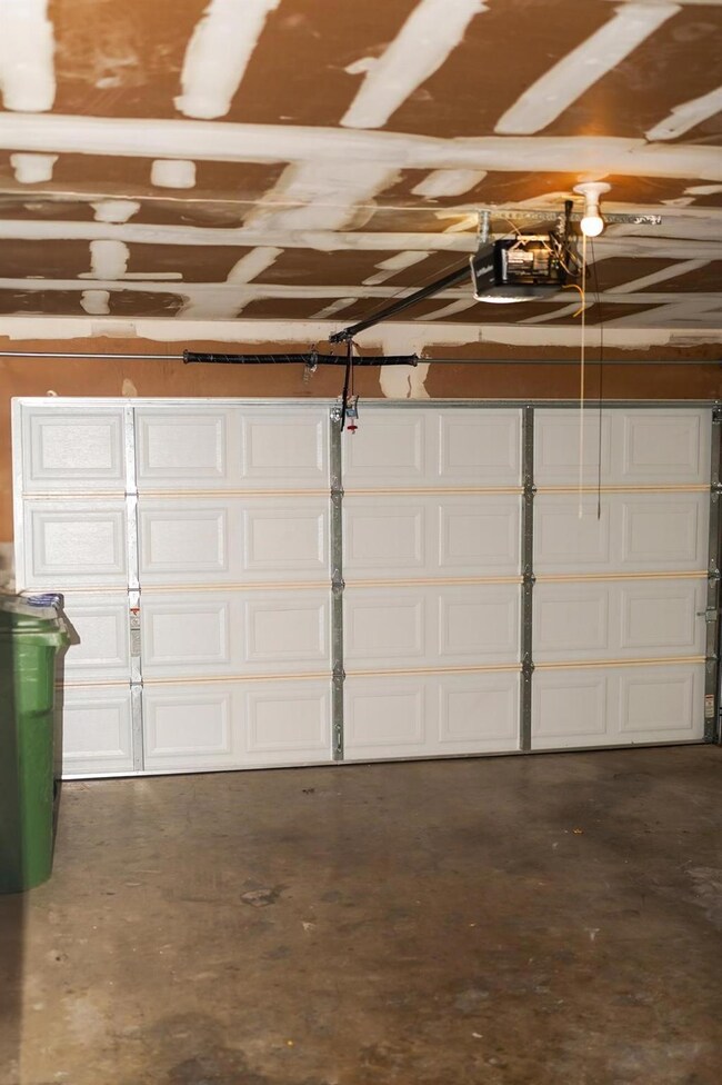 Garage featuring a garage door opener