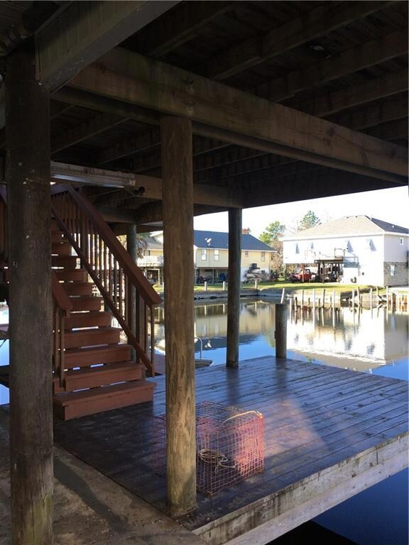 Waterfront access stairs leading to large deck out