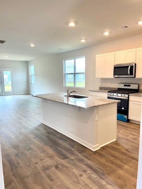 Open floor plan, granite, soft close cabinets & drawers, lots of light!