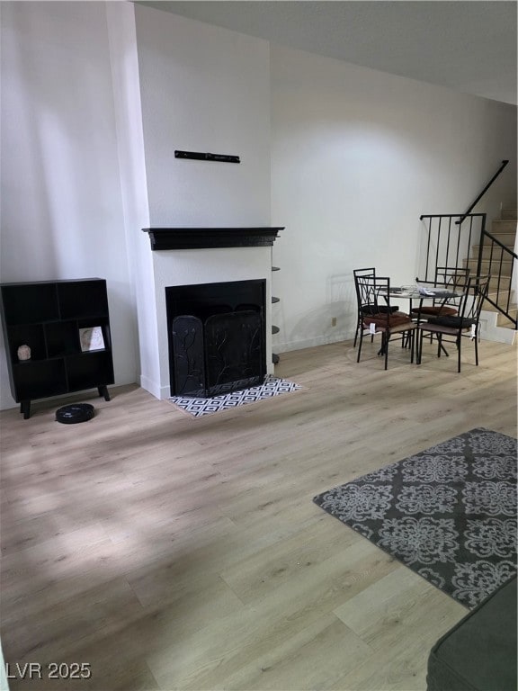 Living room featuring a fireplace with flush heart