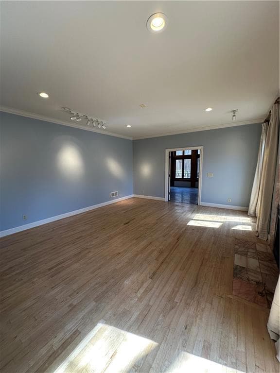 Unfurnished living room featuring visible vents, b