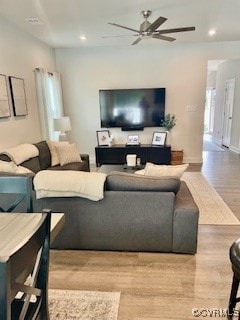 Living area featuring wood finished floors, a ceil