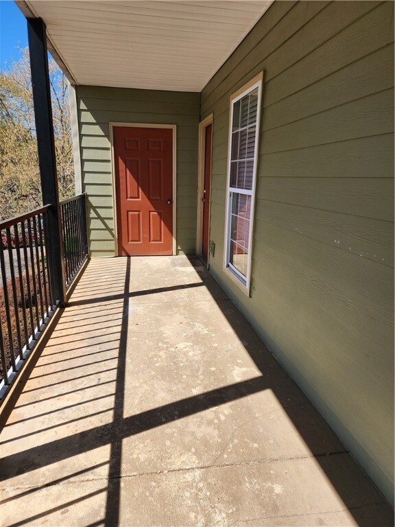 Private balcony with condo access and storage clos