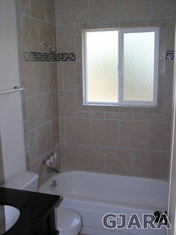 Tiled Shower, Cast Iron Tub, Tile Floor, New Fixtu