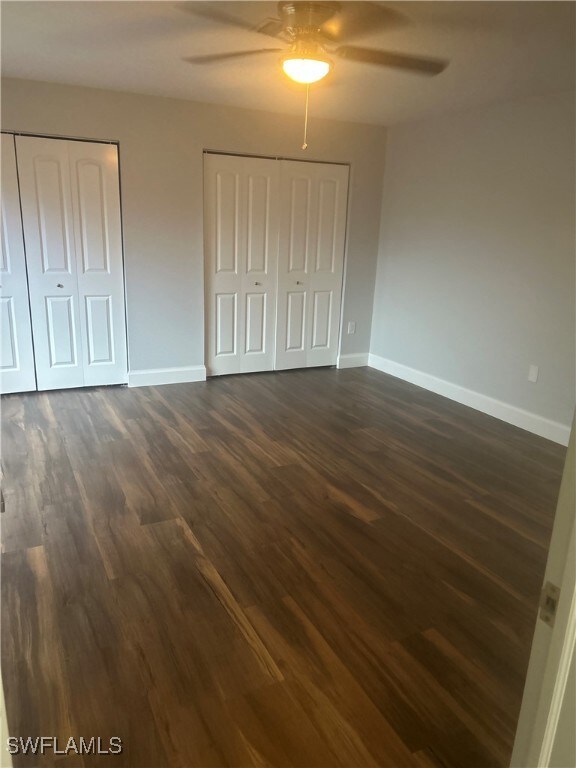 Unfurnished bedroom featuring multiple closets, da