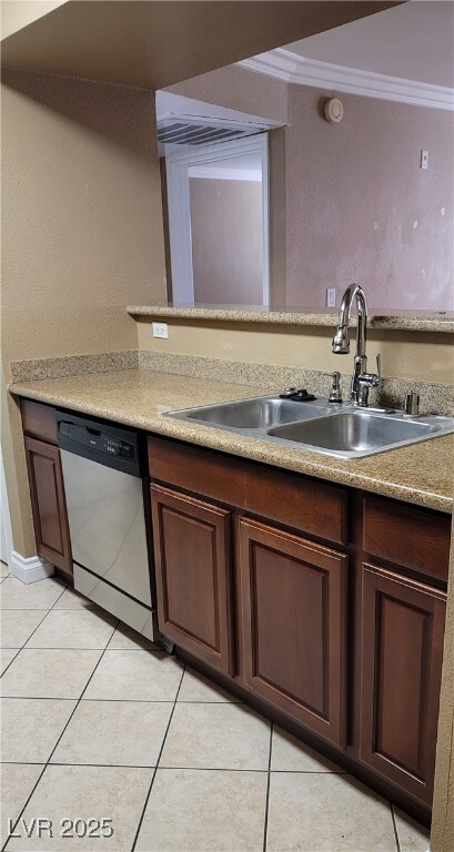 Kitchen with light tile patterned floors, crown mo