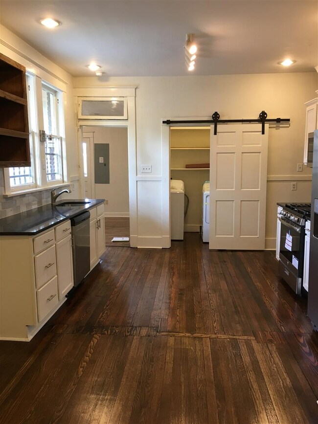 Office/mudroom beyond kitchen with door to backyar