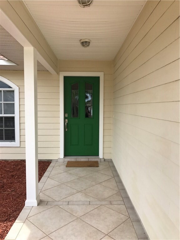 Fresh paint and tiled entryway.