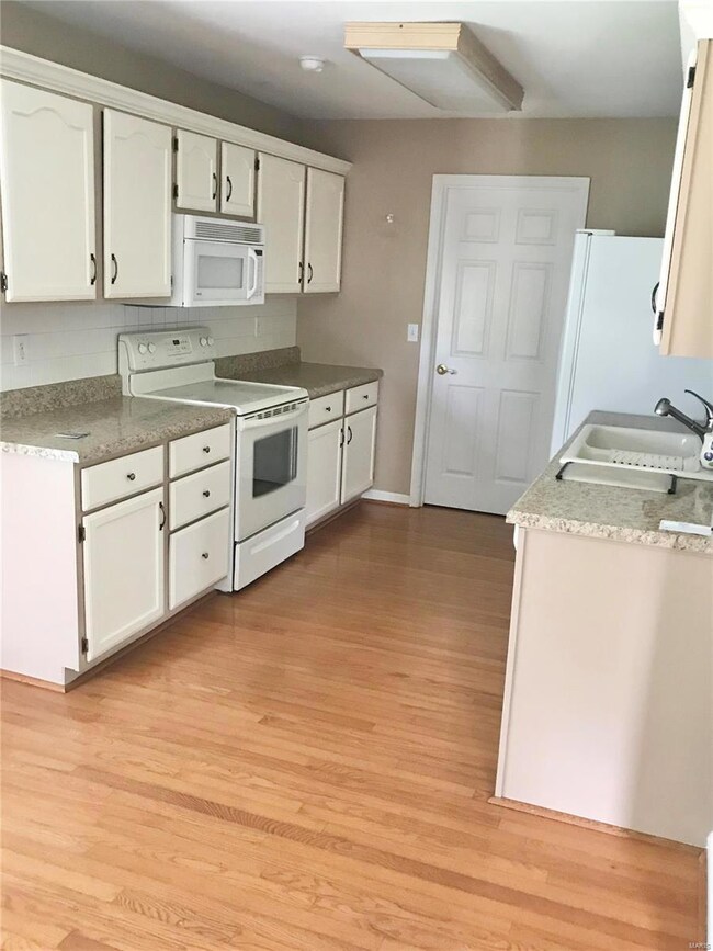 Beautiful Hardwood Floor continues throughout the 