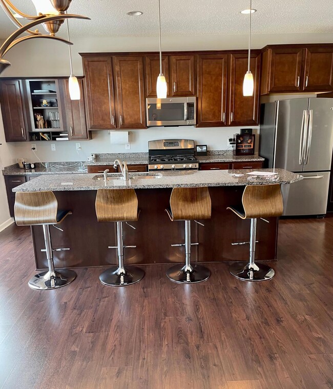 SS appliances/granite countertops/cherry cabinets