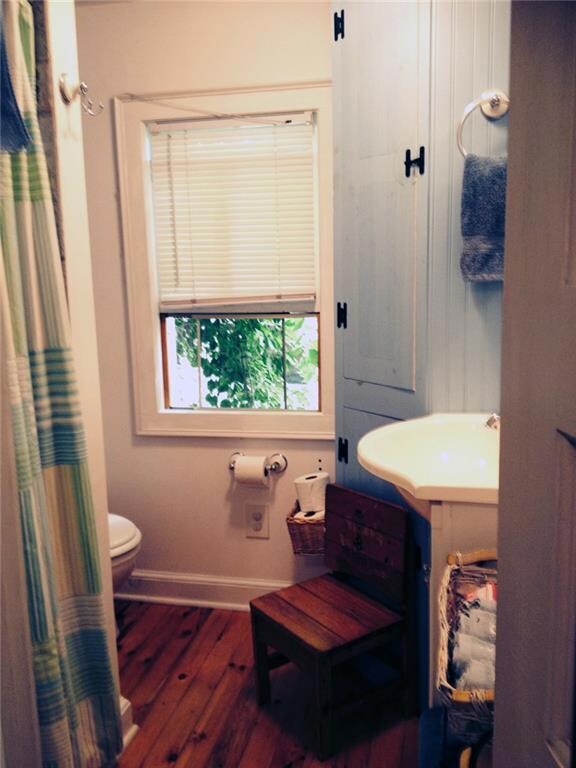 Bathroom with stand up tile shower.