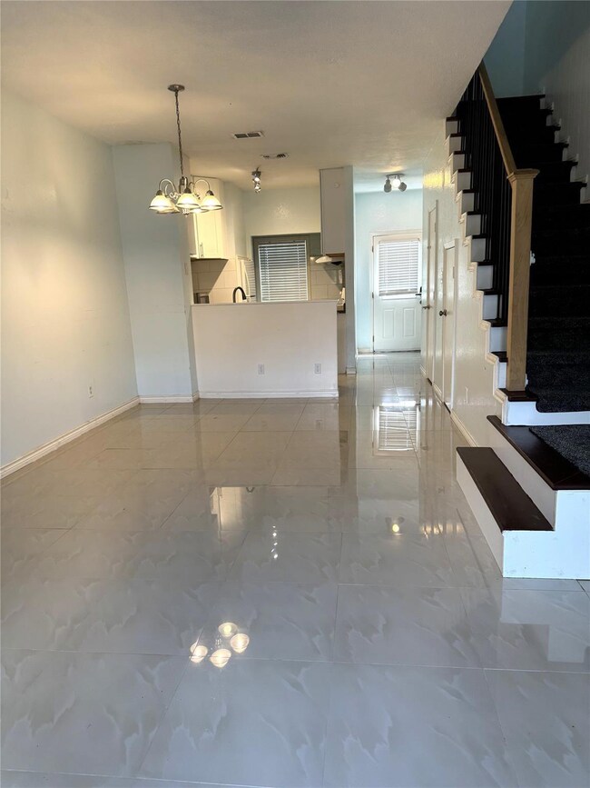Unfurnished living room featuring a notable chande