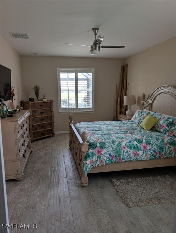 Bedroom featuring a ceiling fan, visible vents, ba