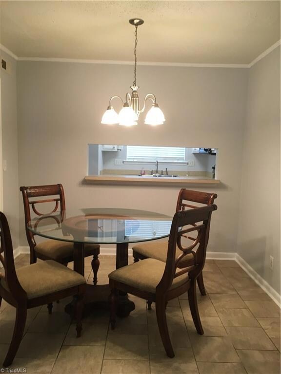 Dining room looking through cutout into kitchen