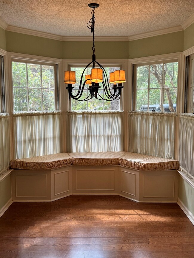 Unfurnished dining area featuring wood-type floori