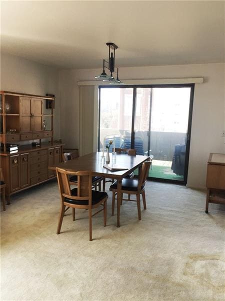Dining room with walkout to balcony.