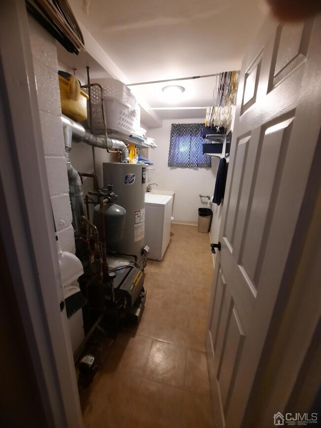 Half Bathroom w washer, heater, and hot water