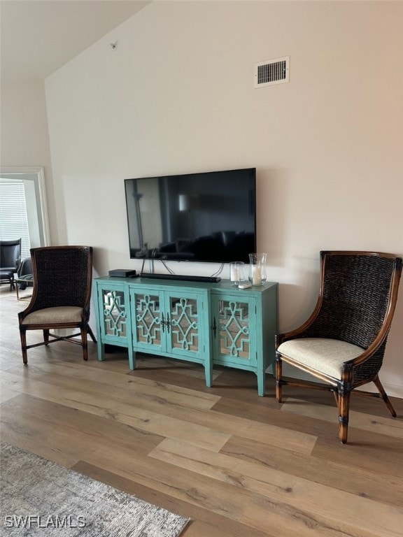 Sitting room featuring wood finished floors and a