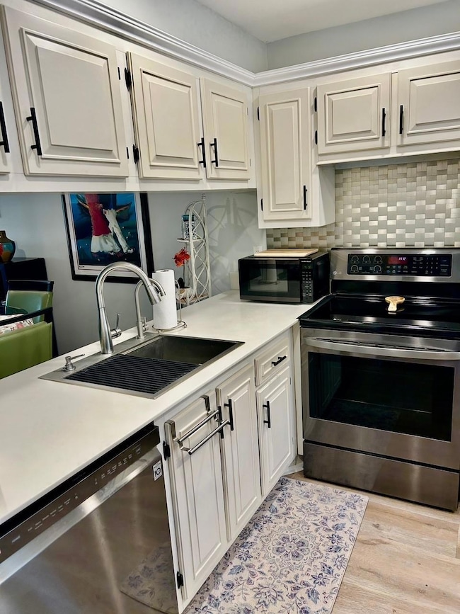 Kitchen is modern and boasts newer appliances.