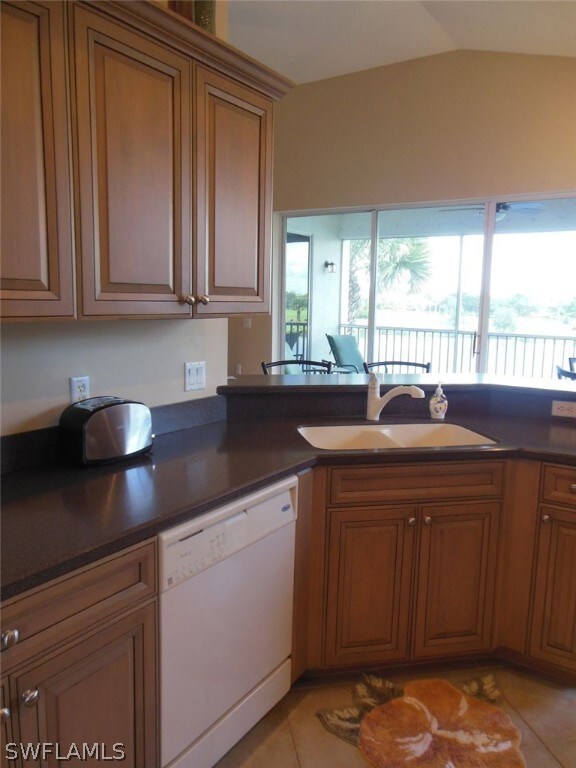 Wood cabinets, corian countertops and all of the k