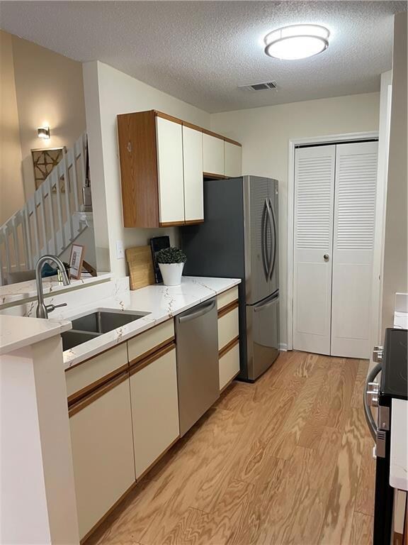 Kitchen with stainless steel appliances, double si